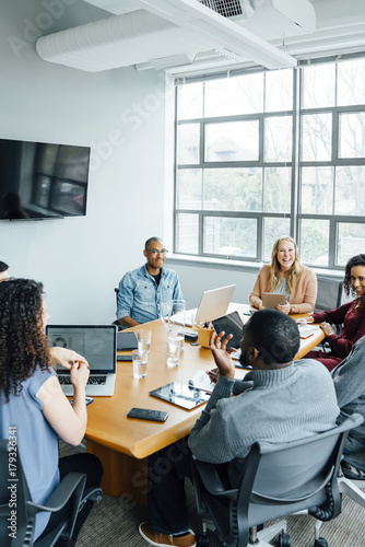 Business people smiling in meeting