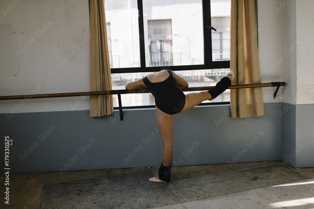 Ballet dancer practicing indoors. Ballet dancer practicing indoors.