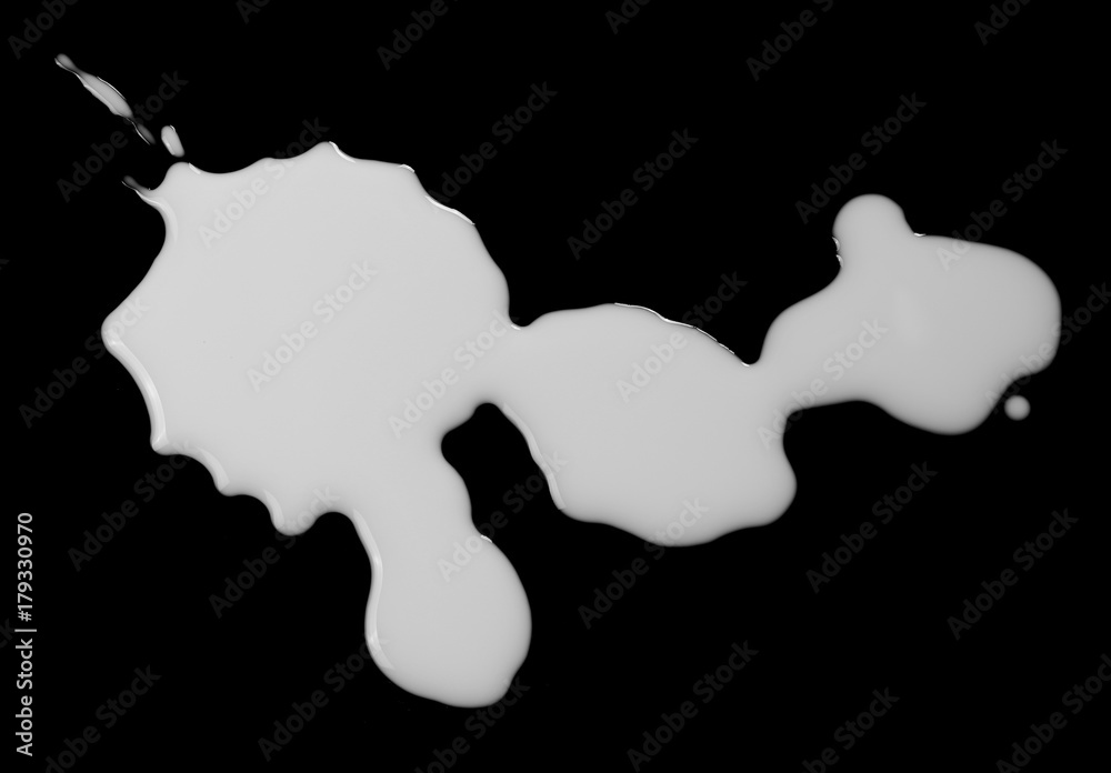 Milk splashes isolated on black background, top view, clipping path Milk splashes isolated on black background, top view, clipping path