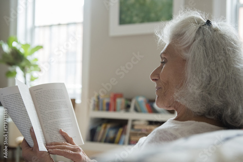 Older woman reading book