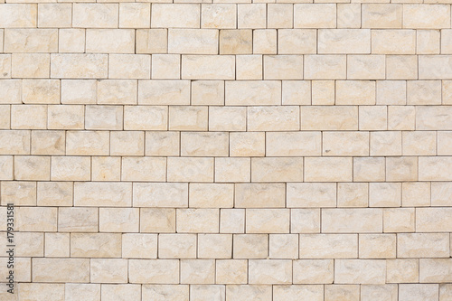 the wall is tiled with natural stone