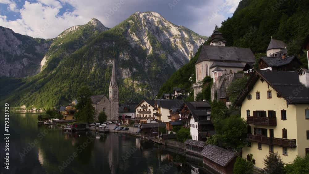 Wide aerial shot of houses at river / Hallstatt, Austria Wide aerial shot of houses at river / Hallstatt, Austria