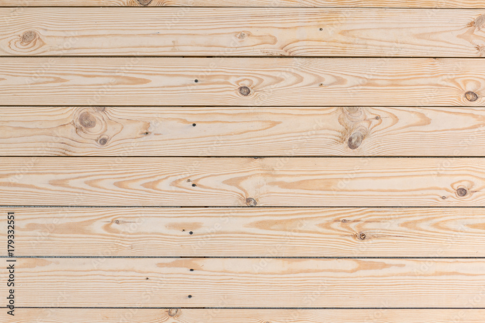 Fototapeta premium wooden wall of new boards, nailed down horizontally