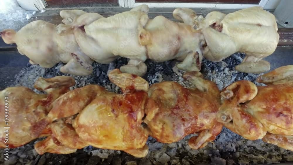roasted chicken grilled on fire, barbeque roasted chicken grilled on fire, barbeque