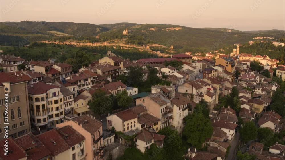 Wide aerial shot of cityscape and landscape at sunset / Veliko Tarnovo, Bulgaria Wide aerial shot of cityscape and landscape at sunset / Veliko Tarnovo, Bulgaria