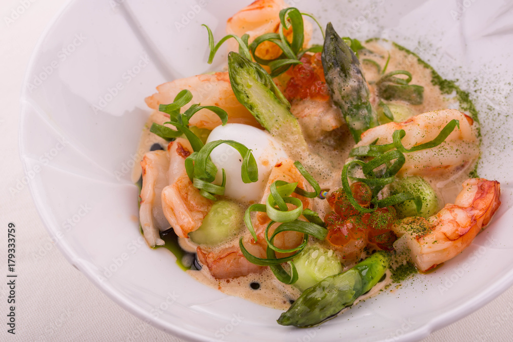 Salad from a lobster filled with cream from a langoustine and quail egg Salad from a lobster filled with cream from a langoustine and quail egg