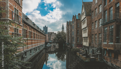 Medieval houses along water canal the old town of Ghent, Belgium © supamotion