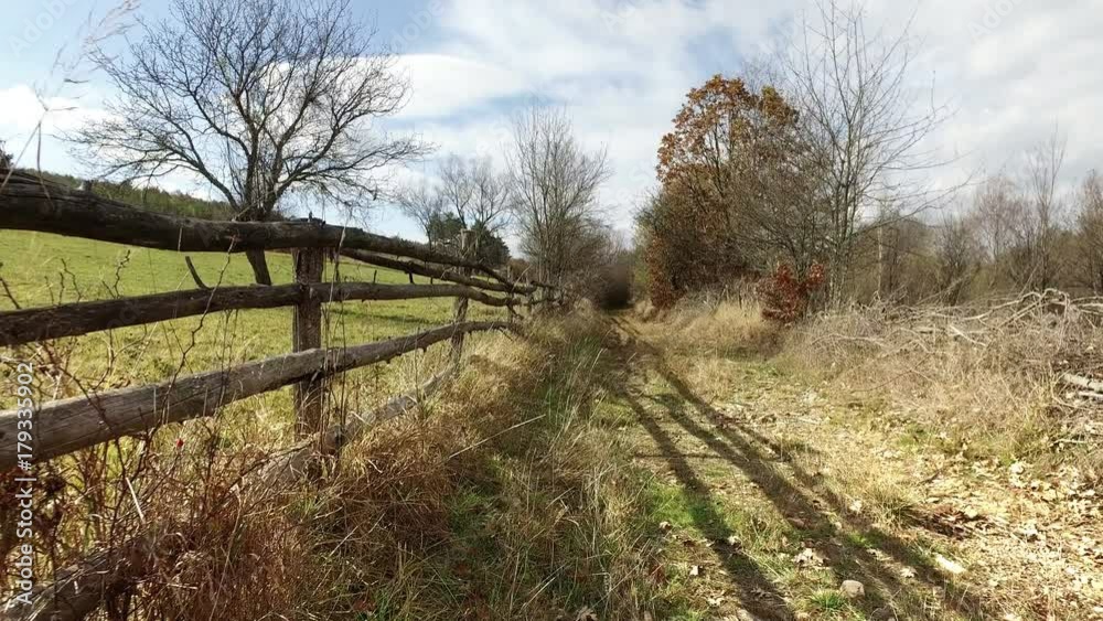 A Wooden Farm Fence and Autumn Colours, Tree with no leaves, Country crane shoot A Wooden Farm Fence and Autumn Colours, Tree with no leaves, Country crane shoot