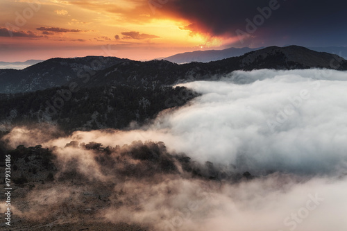 Majestic sunset in the mountains with fog and mist landscape, Turkey, Lycian Way near Tahtali peak