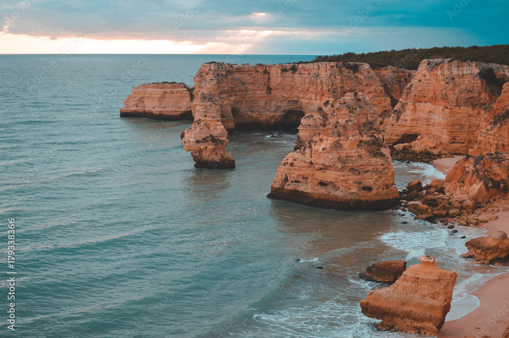 Beautiful cliffs and sea coastline outdoors natural background Portugal Europe. Recreational tourism inspirational scenery photograph