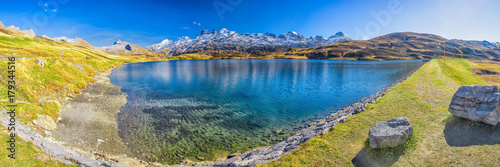 Crystal clear Melchsee and Swiss Alps panorama from Melchsee Frutt, Obwalden, Switzerland, Europe