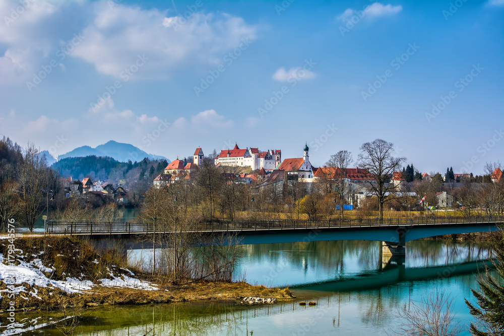 Obraz premium Old buildings of Fussen city. St. Mang Basilica, High Castle. Fussen, Germany