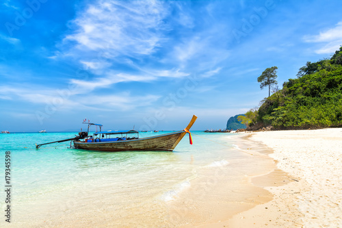 Amazing view of beautiful beach with traditional thailand longtale boat. Location: Bamboo island, Krabi province, Thailand, Andaman Sea. Artistic picture. Beauty world. © olenatur