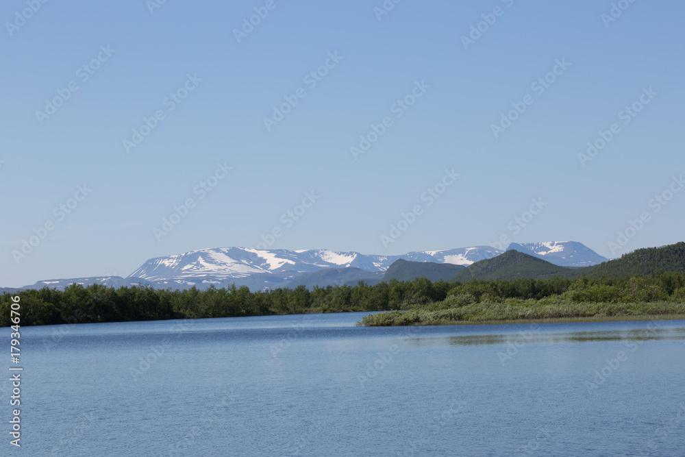 View from the river Könkämäeno to the Scandinavian mountains in Troms, Taiga, summer