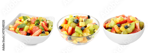 Bowls with fruit salads on white background