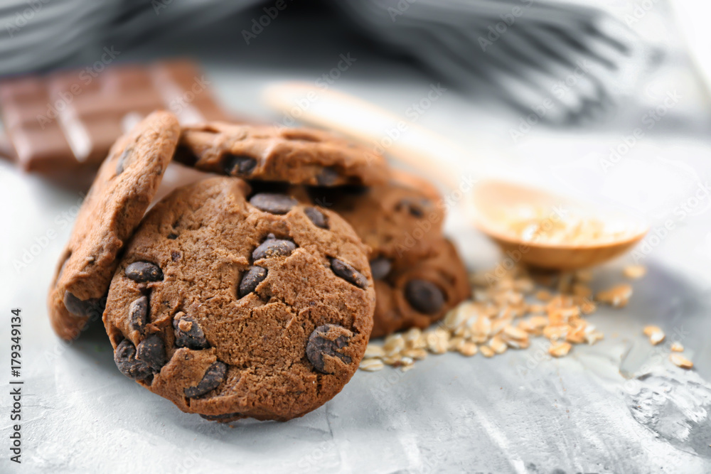 Delicious oatmeal cookies with chocolate chips on table, close up Delicious oatmeal cookies with chocolate chips on table, close up