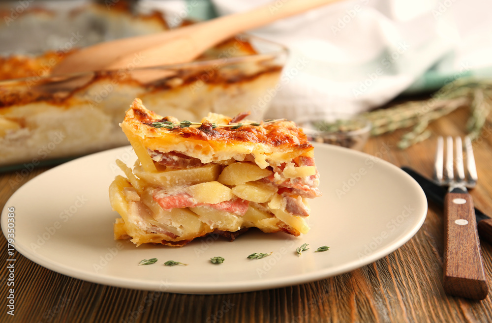 Plate with potato casserole on table Plate with potato casserole on table