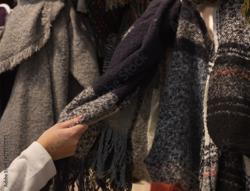 A young woman Shopping a new scarf