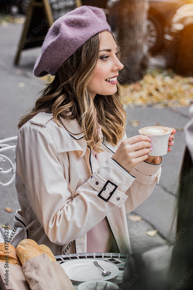 Moments of joy. Side view of beautiful young french woman in beret