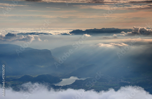 Sea of clouds and autumn mist lit by light of setting sun above Lake Bled, Bohinj mountain range, Pokljuka plateau, Julian Alps Triglav National Park, from Stol Karavanke Kranjska Gorenjska Slovenia
