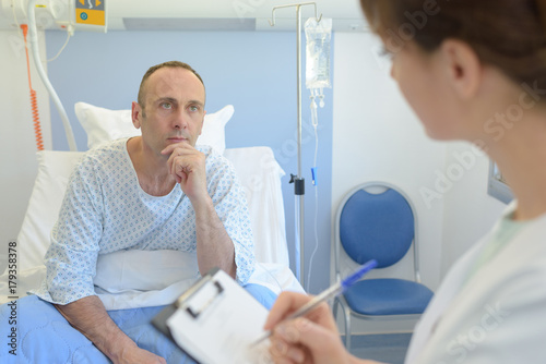Patient listening to nurse