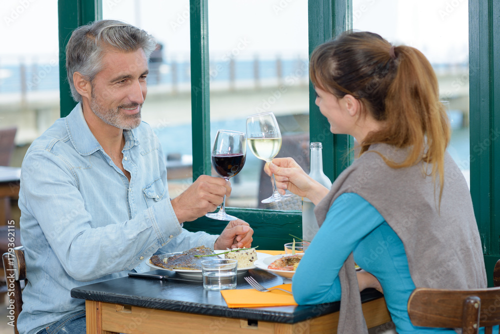 Couple toasting with wineglasses in restaurant Couple toasting with wineglasses in restaurant