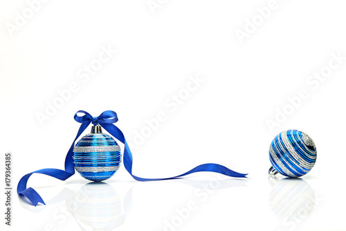 Blue Christmas ball with ribbon bow on white background photo