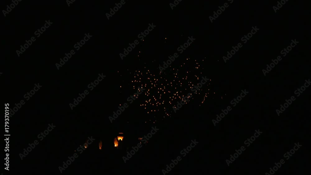 light fest lanterns in background while people in foreground use their own 4k depth of field