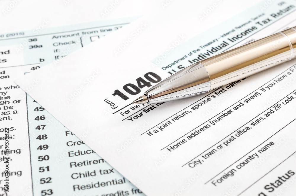 Pen on tax form. Close up. Business concept. Pen on tax form. Close up. Business concept.
