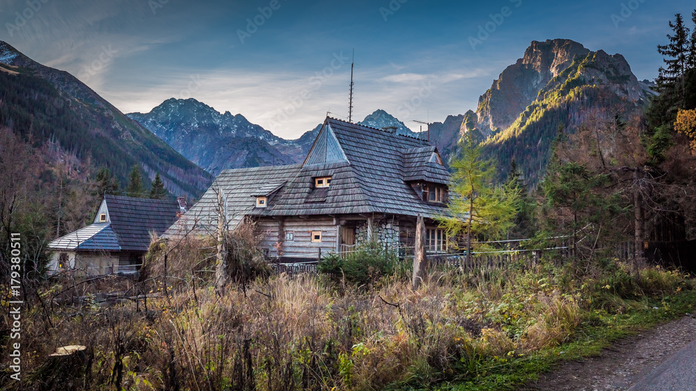Small hut in the middle of the mountains in autumn