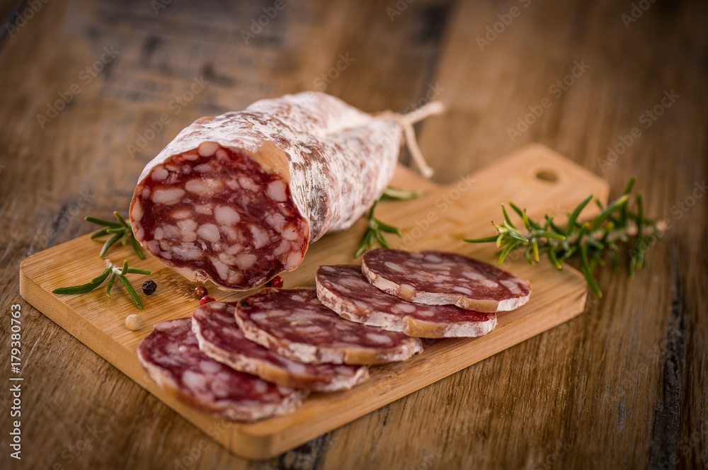 French salami Sausage on a wooden table French salami Sausage on a wooden table