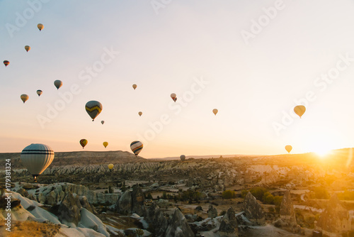 Hot air balloon flying over rock landscape at Cappadocia Turkey © Grigorii Postnikov