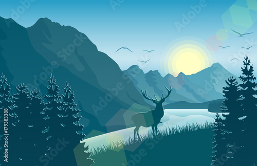 Mountain landscape with deer in a forest near a lake