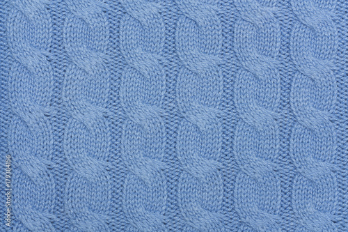 Texture of blue knitted woolen fabric for background