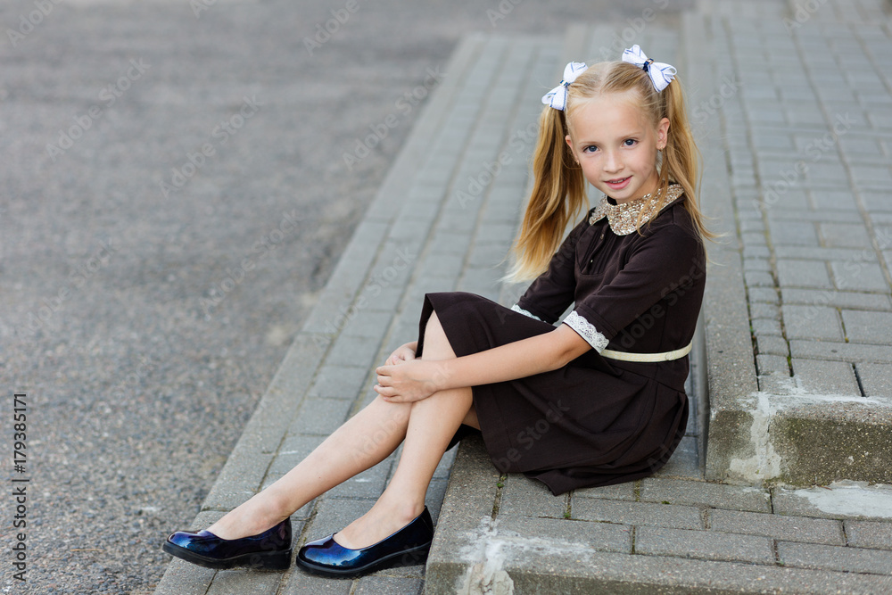 Portrait of a beautiful girl in a school uniform before class at school Portrait of a beautiful girl in a school uniform before class at school
