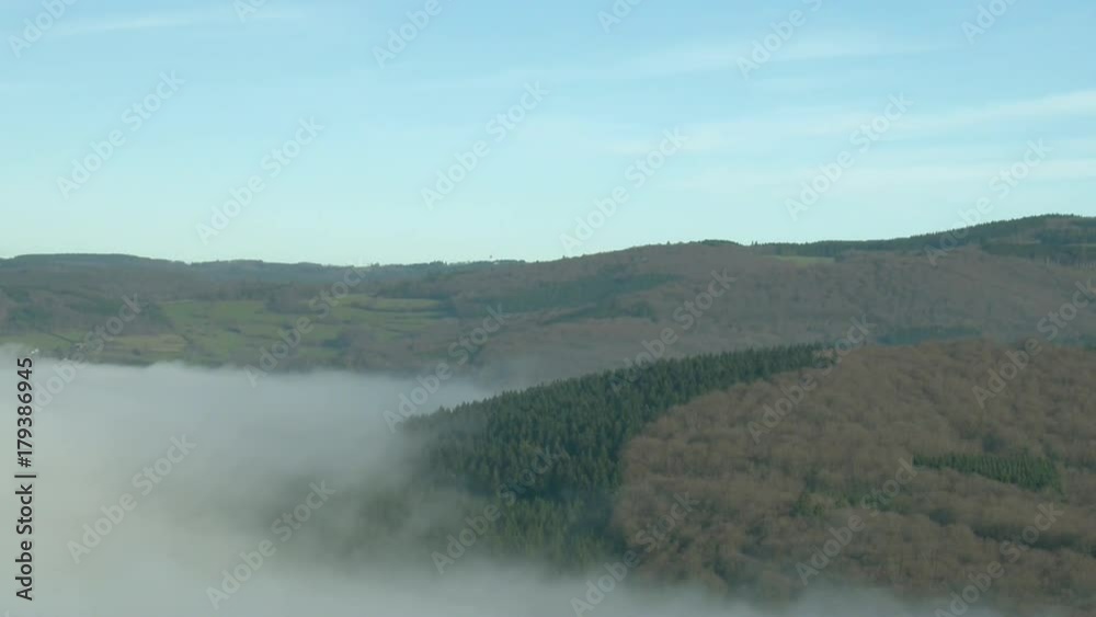 Top shot of low mist covering French countryside and forest. Top shot of low mist covering French countryside and forest.