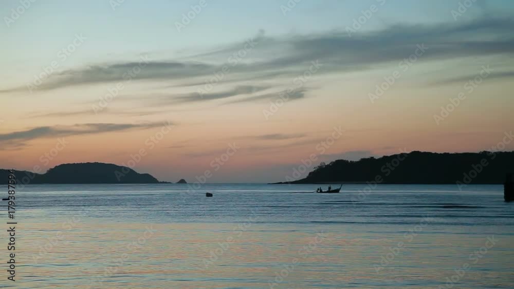 Sunrise on Phuket island Thailand. Seascape with fishers boats. Early morning on Rawai beach. Sunrise on Phuket island Thailand. Seascape with fishers boats. Early morning on Rawai beach.