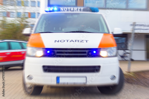 Fototapeta Naklejka Na Ścianę i Meble -  German Notarzt, emergency doctor car from fire department stands on a hospital