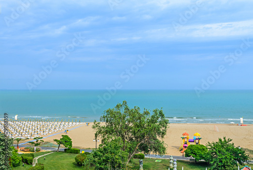 Beach of Black Sea from Albena, Bulgaria with golden sands, blue clear water, green trees