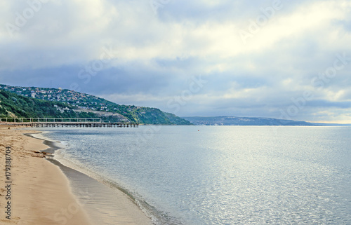 The Black Sea shore from Albena, Bulgaria with golden sands, sun, blue mystic water, green coastline