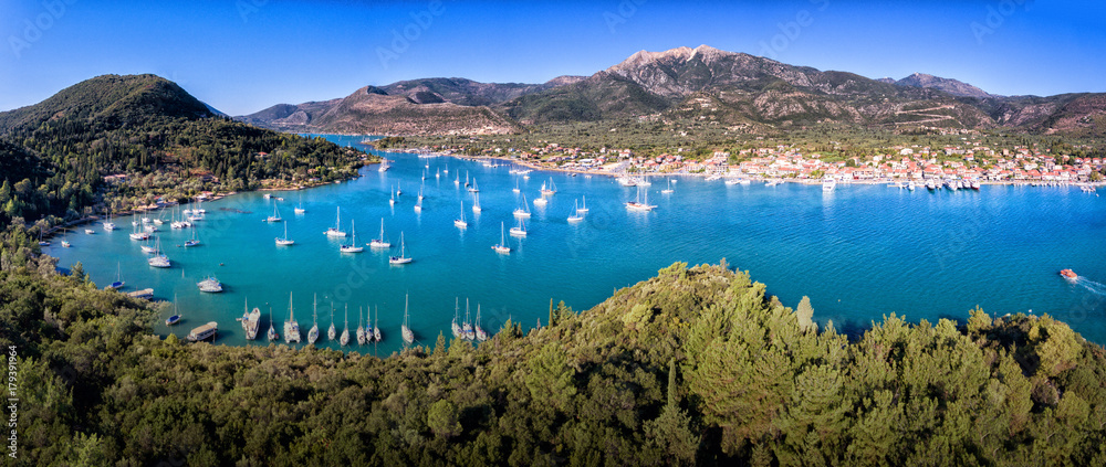 Nydri (Nidri) town in Lefkada Greece Ioanian Island bay panorama yachts and clear blue water in the summer
