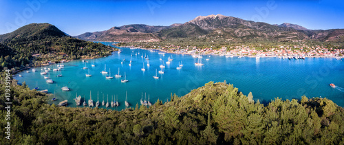 Nydri (Nidri) town in Lefkada Greece Ioanian Island bay panorama yachts and clear blue water in the summer photo