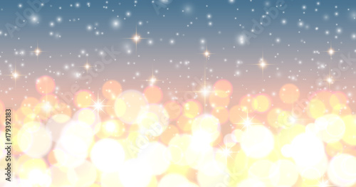 Christmas background, golden blurred lights, snowflakes and glittering bokeh 