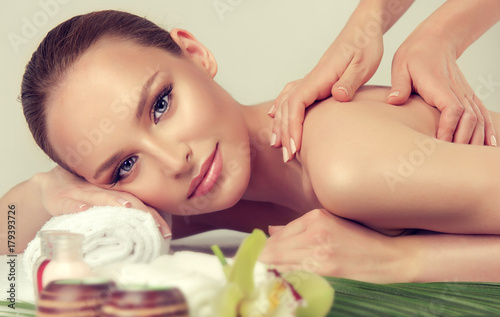 Massage and body care. Spa body massage treatment. Woman having massage in the spa salon for beautiful girl . massage woman hands