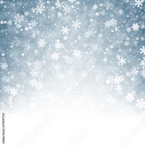 Blue winter background with snowflakes.