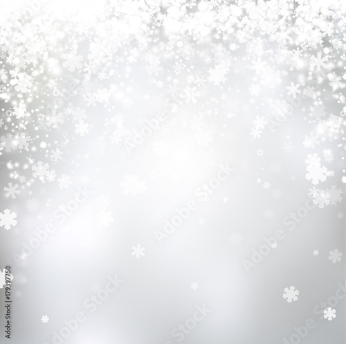 Blurred winter background with snowflakes.