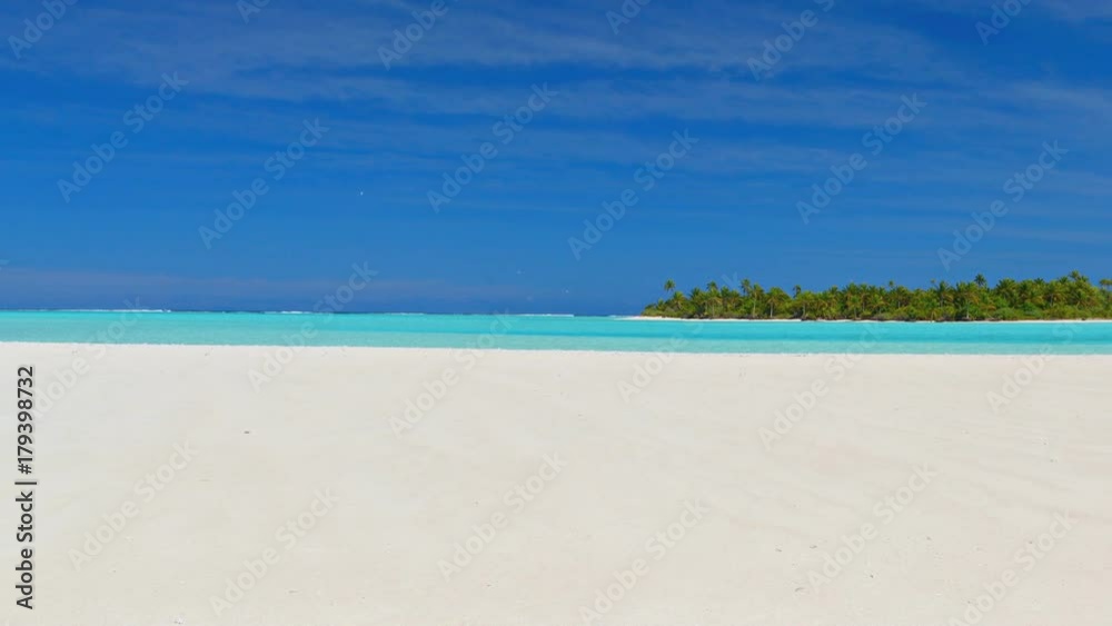 Panorama on turquoise sea at Aitutaki lagoon and desert island from white beach. Cook Islands, South Pacific Ocean. Dreamlike travel destination. Panorama on turquoise sea at Aitutaki lagoon and desert island from white beach. Cook Islands, South Pacific Ocean. Dreamlike travel destination.