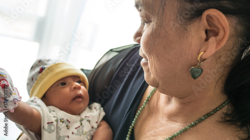 Newborn baby and grand mother