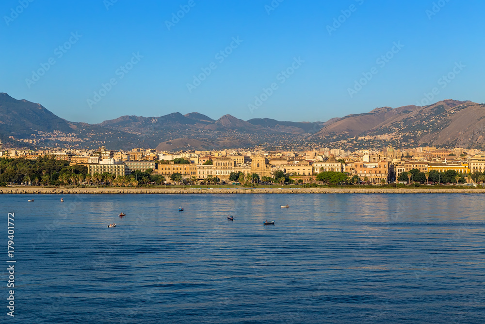 Palermo, Sicily, Italy. Fishing boats in the sea against the backdrop of the city and mountains