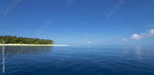 Fototapeta Naklejka Na Ścianę i Meble -   A Maldivian Air Taxi water plain is waiting to accept passengers.